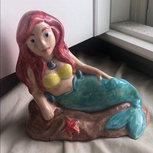 mini statue of the little mermaid.